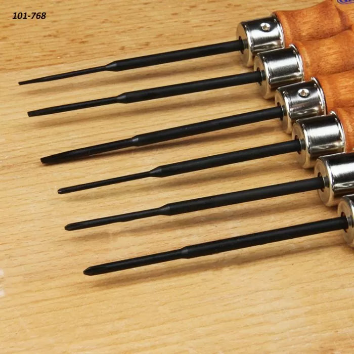 Set of six wood handle needle files for woodworking on a light wooden surface