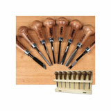Woodworking chisel set with wooden handles and display rack on a wood surface