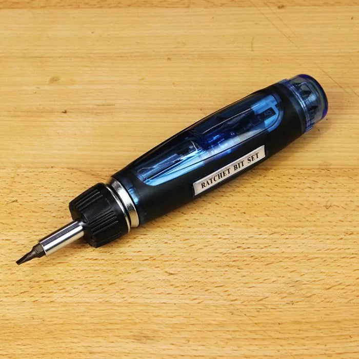 Ratchet screwdriver bit set with interchangeable bits on wooden surface