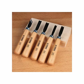 Woodcarving chisel set with wooden handles on a wood block, woodworking tools