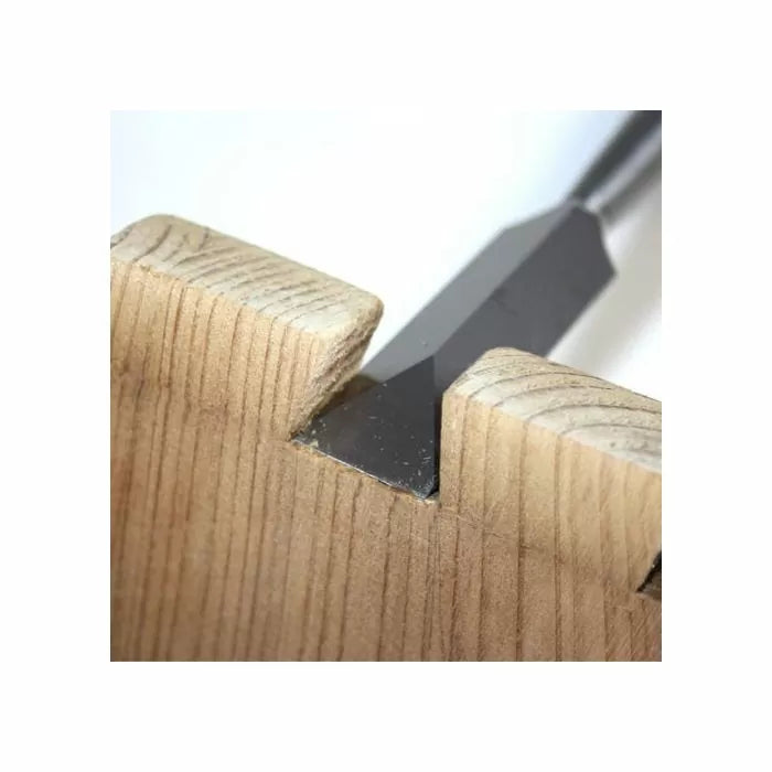 Chisel cutting dovetail joint in wood, woodworking hand tool for precise joinery