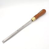 Woodworking paring chisel with long steel blade and wooden handle on white background