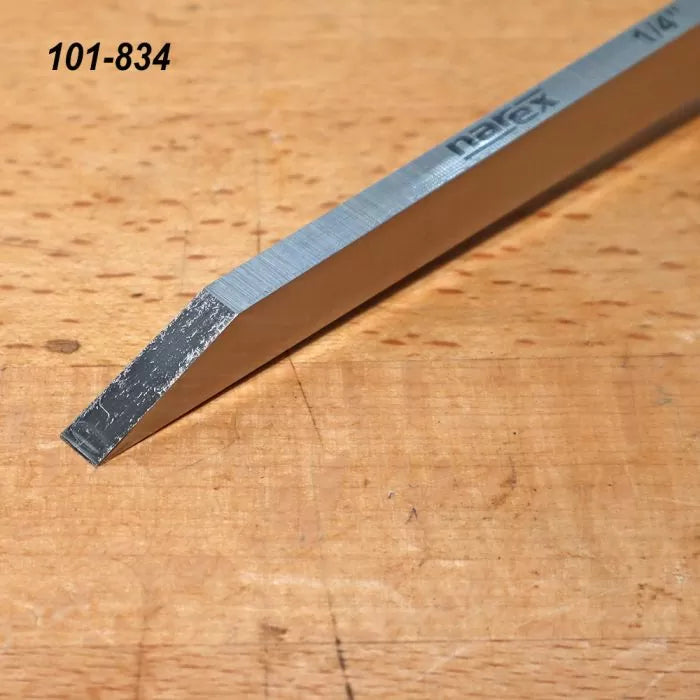 Narex 1/4 inch skew chisel on wood surface, woodworking hand tool for precision cuts