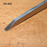 Narex 1/4 inch skew chisel on wood surface, woodworking hand tool for precision cuts