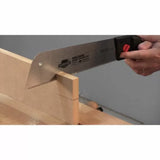 Pull saw cutting precise joinery in hardwood on a woodworking bench