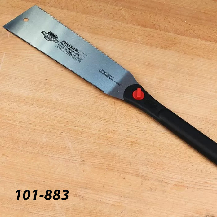 Japanese pull saw with black handle on a wooden workbench, woodworking hand tool