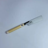 Japanese pull saw with beige handle and sharp steel blade for woodworking