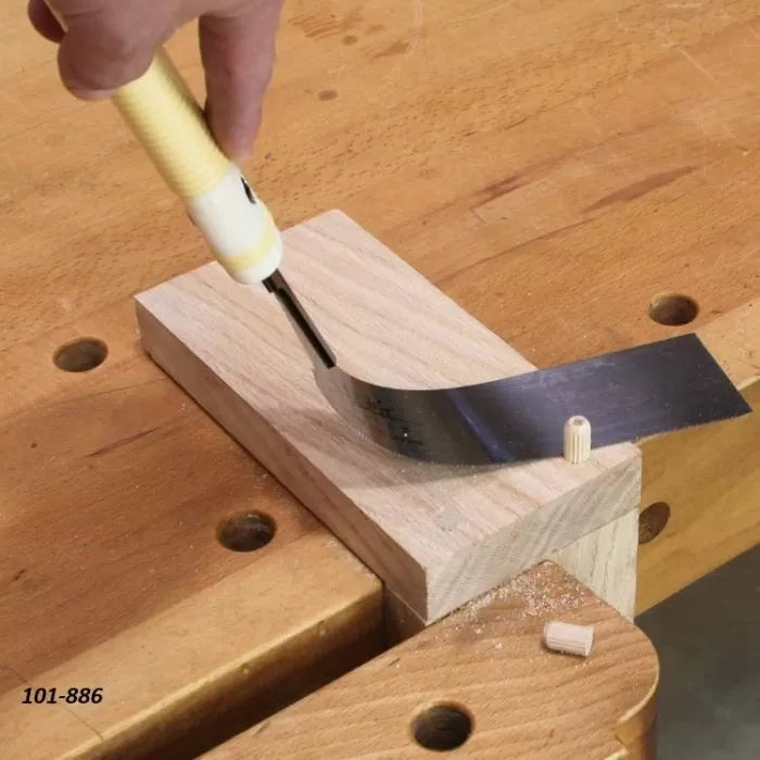 Flush cut saw trimming wood dowel on a workbench, woodworking hand tool in use.