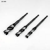 Set of three woodworking drill bits with hex shanks on white background.