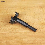 Forstner drill bit for woodworking displayed on a light wood surface