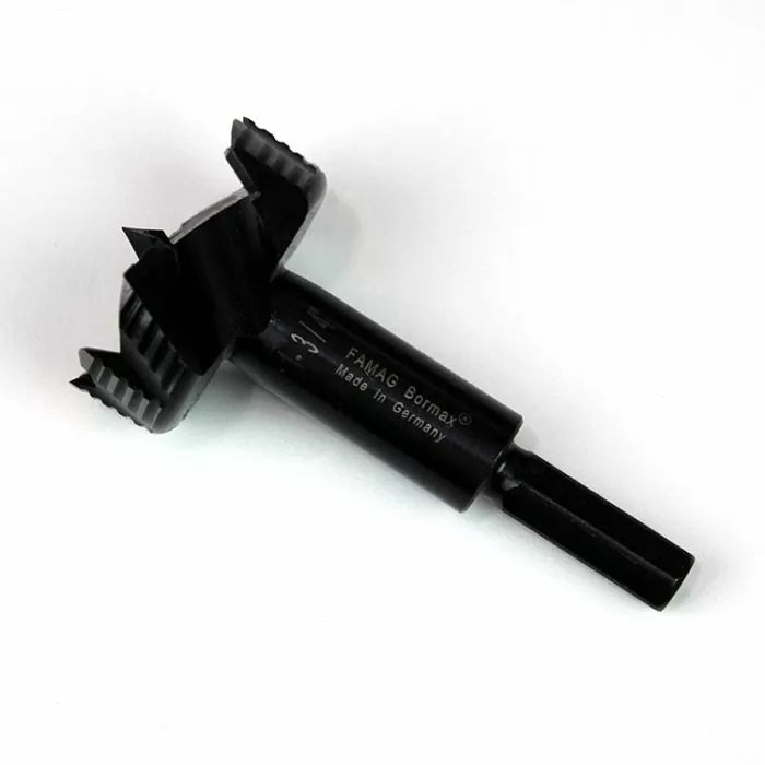 Close-up of a FAMAG Bormax Forstner drill bit for woodworking on white background