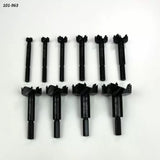 Set of ten black Forstner drill bits arranged on white background, woodworking tool set