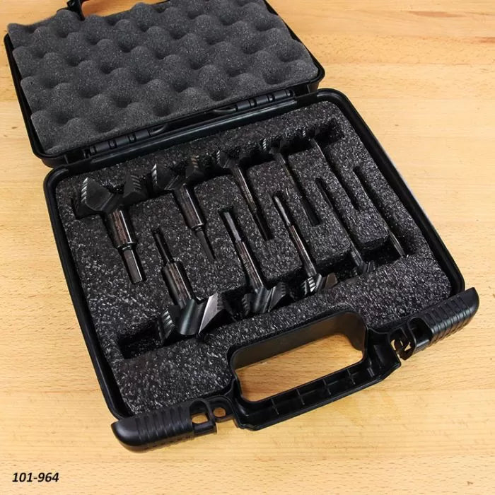 Forstner drill bit set in foam-lined carrying case on wood surface