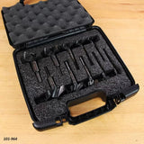 Forstner drill bit set in foam-lined carrying case on wood surface