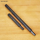Two steel router bit extensions on a wood surface, woodworking tool accessories