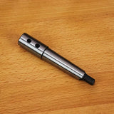 Steel woodworking lathe drive center with set screws on a wooden surface