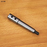 Steel woodworking mortising chisel tool on wood surface