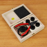 Woodworking router collet maintenance kit with pliers and bushings in a wooden box