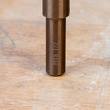 Closeup of HSS 1/2 marking on metal woodworking tool shank on a workbench