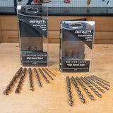 High speed steel brad point drill bit sets in inch and metric sizes on workbench