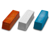 Three wood finishing wax bars in orange, white, and blue on a black background.