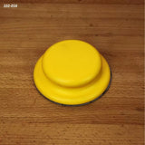 Yellow hand sanding pad for woodworking on a wood surface