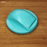 Blue hand sanding block on a wooden surface, woodworking tool for smoothing wood.