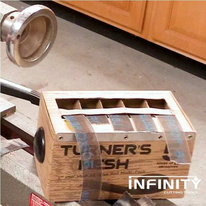 Turner's sanding mesh multi-pack in wooden dispenser on woodworking bench