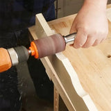 Woodworker using a drum sander attachment on a curved wood edge