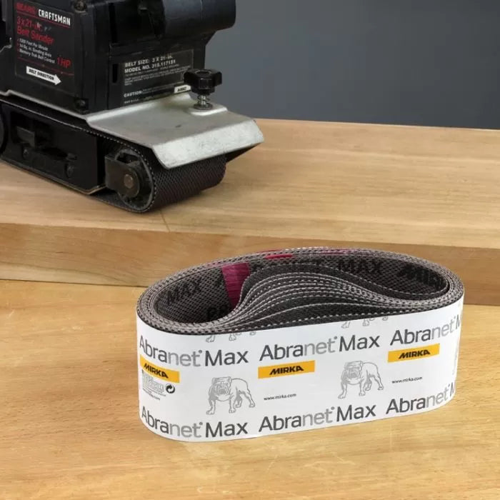 Mirka Abranet Max sanding belt for belt sander on wood workbench, woodworking tool accessory