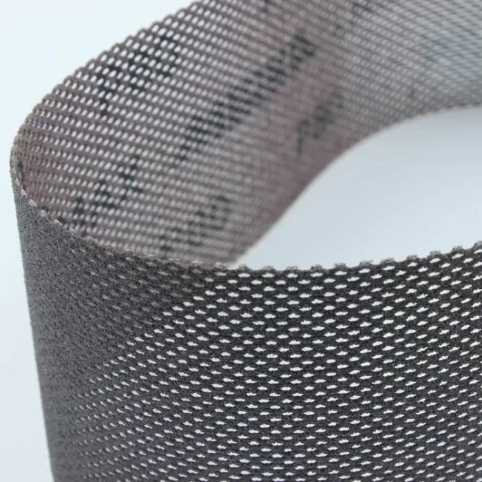 Close-up of flexible mesh sanding abrasive strip for woodworking dust-free sanding