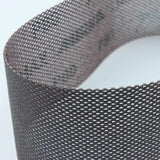 Close-up of flexible mesh sanding abrasive strip for woodworking dust-free sanding
