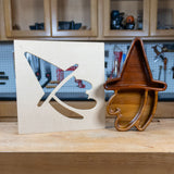 Woodworking witch tray and MDF template on workbench with tools in background