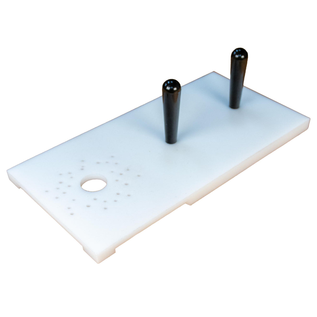 Woodworking jig with two black handles and alignment holes on a white rectangular plate