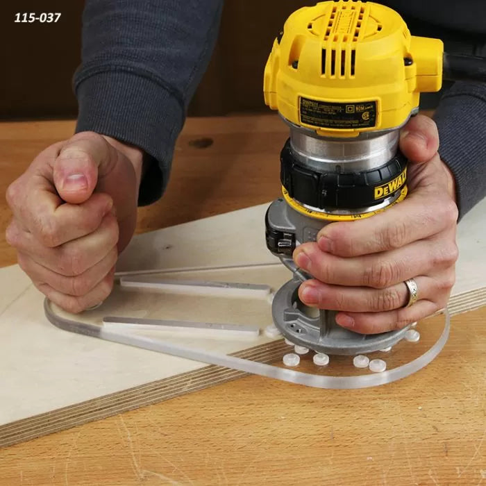 Person using handheld router with clear acrylic jig on plywood for precise woodworking