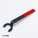 Open-end spanner wrench with red handle for woodworking tool adjustment on white background