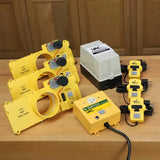 Dust collection blast gate automation kit with yellow iVAC Pro components on a wood workbench