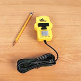 Yellow power tool switch with auto off on settings and long cord on wooden surface, pencil beside