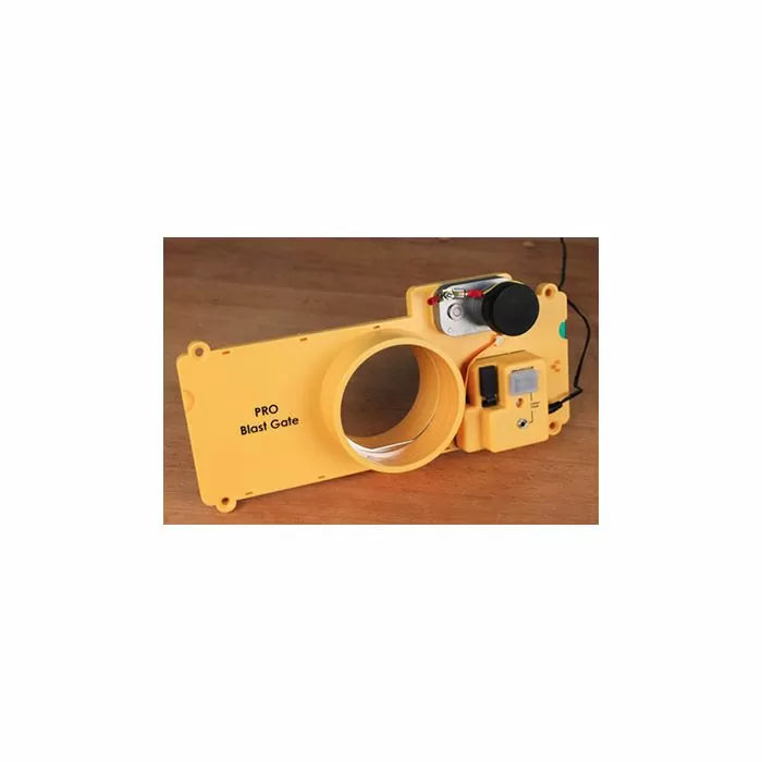 Yellow PRO blast gate with switch for dust collection on wood surface, woodworking tool accessory