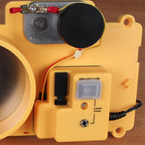 Close-up of yellow woodworking tool switch panel with wiring and control buttons on wood surface