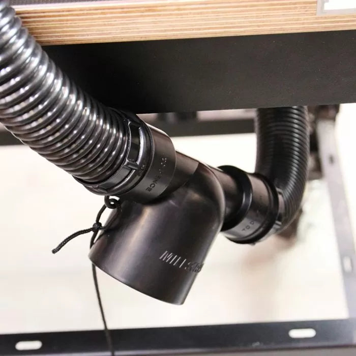 Dust collection hose and Y-fitting installed under a woodworking router table