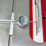 Measuring gauge on a table saw measuring blade straightness
