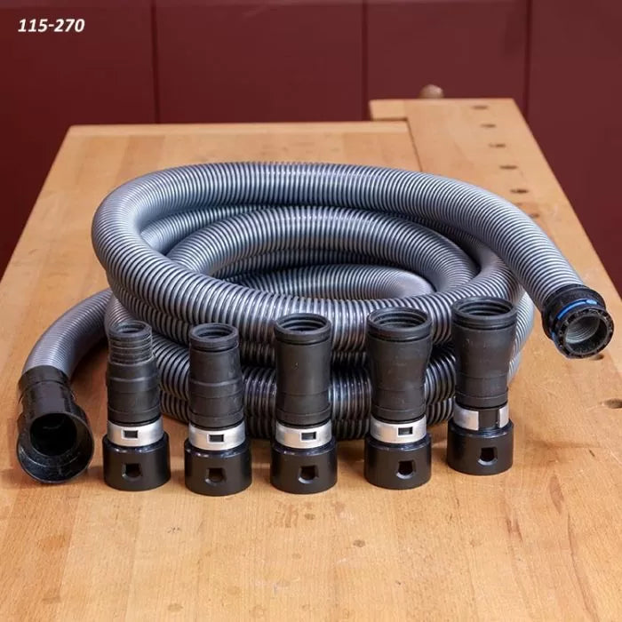 Flexible dust collection hose with five black hose adapters on a woodworking bench