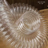 Clear flexible dust collection hose coiled on a woodworking bench, 4 inch diameter, 10 foot length