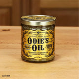 Odie's Oil wood finish jar on a wooden surface, ideal for woodworking and surface protection