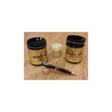 Wood finish jars, small container, and dark wood pen on a wood surface for woodworking projects.