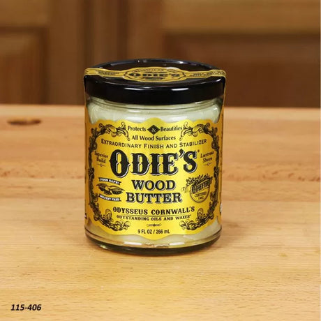 Odie's Wood Butter jar for woodworking finish on a wooden surface