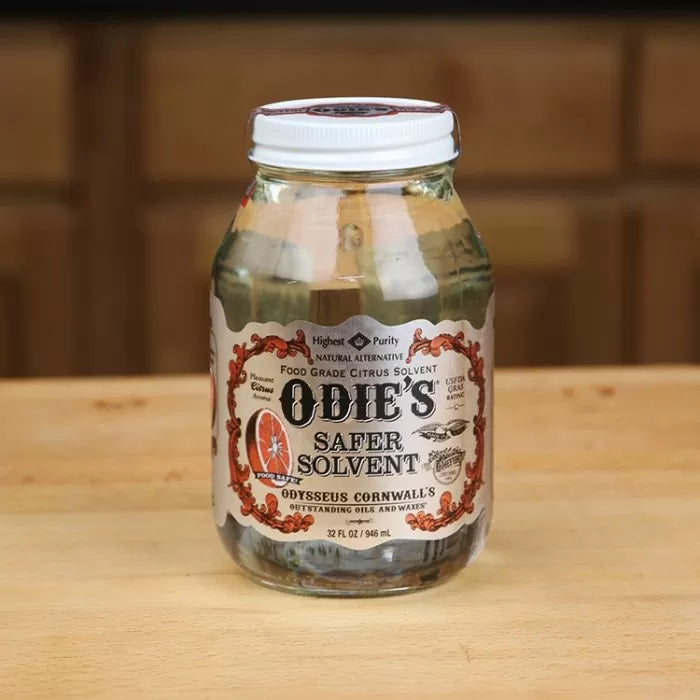 Odie's Safer Solvent clear jar on wooden surface, food grade citrus solvent for woodworking