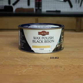 Liberon Wax Polish Black Bison Clear wood finish can on a woodworking bench