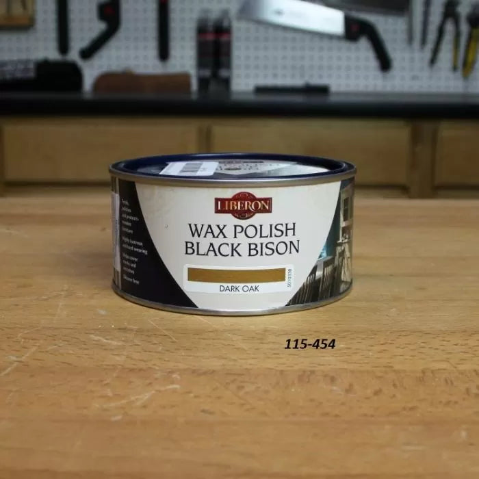 Liberon Black Bison dark oak wax polish tin on a woodworking bench